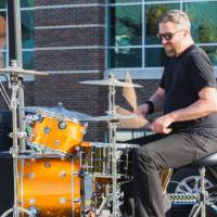 Jesse Ray and the Carolina Catfish band member playing drums.